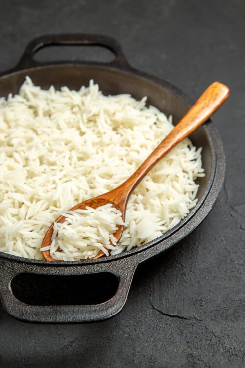 front-view-cooked-rice-inside-pan-dark-desk-meal-food-rice-eastern-dinner PLAIN RICE